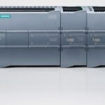 Siemens SIMATIC S7-1200 PLC system with multiple connected modules on a white surface